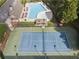 An aerial shot of a community pool and tennis court, perfect for recreation and relaxation at 6520 Fairfield Trce, Suwanee, GA 30024