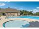A tranquil community pool area includes a spa and comfortable lounge seating for relaxation and enjoyment at 6520 Fairfield Trce, Suwanee, GA 30024