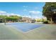 Enjoy a game on the community tennis court, featuring a shaded gazebo and nearby pool at 6520 Fairfield Trce, Suwanee, GA 30024