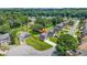 Aerial view of the property showcasing the home's placement in a suburban neighborhood with mature trees at 1890 Owens Trl, Rex, GA 30273