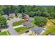 Aerial view displaying the property's location in a neighborhood with lush surroundings and well-maintained lawns at 1890 Owens Trl, Rex, GA 30273