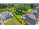 An aerial shot showing a home with a spacious backyard and a wooden fence for privacy at 1890 Owens Trl, Rex, GA 30273