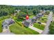 Aerial shot of a home highlighting its landscaped yard, fencing, and location within a suburban community at 1890 Owens Trl, Rex, GA 30273