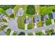 An aerial view of a single-Gathering home in a suburban neighborhood with lush greenery at 1890 Owens Trl, Rex, GA 30273