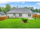 A well-maintained backyard with lush green grass and a wooden fence at 1890 Owens Trl, Rex, GA 30273