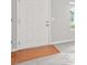 Neutral interior of a home featuring a white door with wood transition at 1890 Owens Trl, Rex, GA 30273