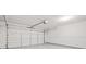 Spacious garage with a white door and light-colored floors and walls at 1890 Owens Trl, Rex, GA 30273