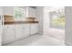 Kitchen view includes an eat-in area with a window and views to the backyard at 1890 Owens Trl, Rex, GA 30273