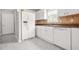 Spacious kitchen with a refrigerator and tiled backsplash and ample counter space at 1890 Owens Trl, Rex, GA 30273