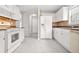 Open concept kitchen showcasing modern appliances, plenty of cabinets, and stylish tile backsplash at 1890 Owens Trl, Rex, GA 30273