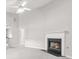 Bright living room featuring fireplace, lots of light, neutral walls and carpeting at 1890 Owens Trl, Rex, GA 30273