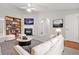 Bright living room featuring modern decor, a fireplace, and neutral walls and carpet at 1890 Owens Trl, Rex, GA 30273