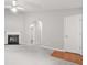Interior of a living room with a fireplace, a vaulted ceiling, and a passageway leading to other rooms at 1890 Owens Trl, Rex, GA 30273