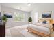 Bright and airy main bedroom with a large window, modern decor and ensuite bathroom at 1890 Owens Trl, Rex, GA 30273