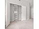 Walk-in closet with ample shelving and rods for organized storage in this modern home at 1890 Owens Trl, Rex, GA 30273