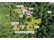 Aerial view featuring the main house, pool house, greenhouse, garage apartment, gate and gazebo location at 1961 Luke Edwards Rd, Dacula, GA 30019