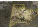 Plat map shows the 10+ acre parcel and the location of the house and outbuildings within the lot lines at 1961 Luke Edwards Rd, Dacula, GA 30019