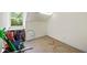Attic with window and carpet being used for storage at 1961 Luke Edwards Rd, Dacula, GA 30019