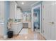 Bright bathroom featuring white cabinets, a spacious countertop, and tiled floors at 1961 Luke Edwards Rd, Dacula, GA 30019