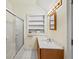 Bathroom featuring a sink, vanity, shelving, and a shower with glass doors at 1961 Luke Edwards Rd, Dacula, GA 30019