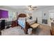 Bedroom showcasing natural light, a ceiling fan, and gray walls at 1961 Luke Edwards Rd, Dacula, GA 30019