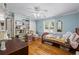 Comfortable bedroom with hardwood floors, built-in shelves, and plenty of natural light at 1961 Luke Edwards Rd, Dacula, GA 30019