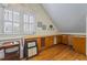 Bright bonus room with hardwood floors, a built in wine rack and custom cabinet storage at 1961 Luke Edwards Rd, Dacula, GA 30019