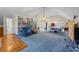 Spacious bonus room featuring a large built-in bookshelf, sitting area and craft tables at 1961 Luke Edwards Rd, Dacula, GA 30019