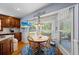 Eat-in kitchen area featuring a wood table, a window with bright view, and hardwood floors at 1961 Luke Edwards Rd, Dacula, GA 30019