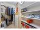 Packed closet with assorted personal items and storage at 1961 Luke Edwards Rd, Dacula, GA 30019