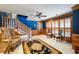 Elegant Foyer featuring dark blue walls with white trim, hardwood accents and decorative rug at 1961 Luke Edwards Rd, Dacula, GA 30019