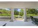 View of the long front yard featuring a fountain and mature trees, as seen from the front porch at 1961 Luke Edwards Rd, Dacula, GA 30019