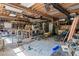 Spacious garage/workshop with exposed wood beams, abundant storage space and workspace at 1961 Luke Edwards Rd, Dacula, GA 30019