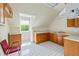 Attic Kitchenette featuring wood cabinets, sink, countertop, and a window at 1961 Luke Edwards Rd, Dacula, GA 30019