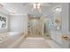 Large main bathroom with double shower, jacuzzi and decorative window at 1961 Luke Edwards Rd, Dacula, GA 30019