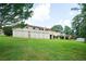 Wide, well-manicured backyard, with mature trees and a shed behind the home at 2302 Springside Way, Decatur, GA 30032