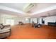 Spacious carpeted basement featuring a seating area and workout equipment at 2302 Springside Way, Decatur, GA 30032