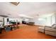 Spacious basement with orange carpet, offering ample room for a home gym and a seating area at 2302 Springside Way, Decatur, GA 30032