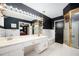 Stylish bathroom showcasing double sinks, modern lighting, and a convenient shower with glass enclosure at 2302 Springside Way, Decatur, GA 30032