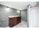 Bathroom with grey walls, wood floors, and vanity with stone countertop and drawers at 2302 Springside Way, Decatur, GA 30032