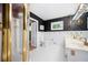 Elegant bathroom featuring double sinks, black accent wall and a glass enclosed shower at 2302 Springside Way, Decatur, GA 30032