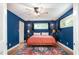 Inviting bedroom with blue walls, hardwood floors, and ample natural light at 2302 Springside Way, Decatur, GA 30032