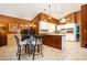 Open-concept kitchen featuring a breakfast bar, stainless steel appliances, and wood accents at 2302 Springside Way, Decatur, GA 30032