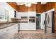 Modern kitchen featuring white cabinets, stainless steel appliances, and wood accents at 2302 Springside Way, Decatur, GA 30032