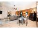 Cozy living space featuring a brick fireplace, adjacent to a kitchen with a breakfast bar and wood paneling at 2302 Springside Way, Decatur, GA 30032