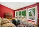 Bright living room with a piano and sliding glass doors leading to a patio at 2302 Springside Way, Decatur, GA 30032