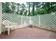 Cozy patio with brick accents and a lattice wall perfect for relaxing outdoors at 2302 Springside Way, Decatur, GA 30032