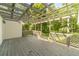 Open back deck with a wood plank floor, partial shade, and a lattice railing at 4120 Grady Smith Rd, Loganville, GA 30052