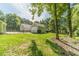 Spacious backyard featuring lush lawn, fenced perimeter, and mature trees at 4120 Grady Smith Rd, Loganville, GA 30052