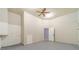 Basement area with painted block walls, sealed floor, and access to an additional room at 4120 Grady Smith Rd, Loganville, GA 30052